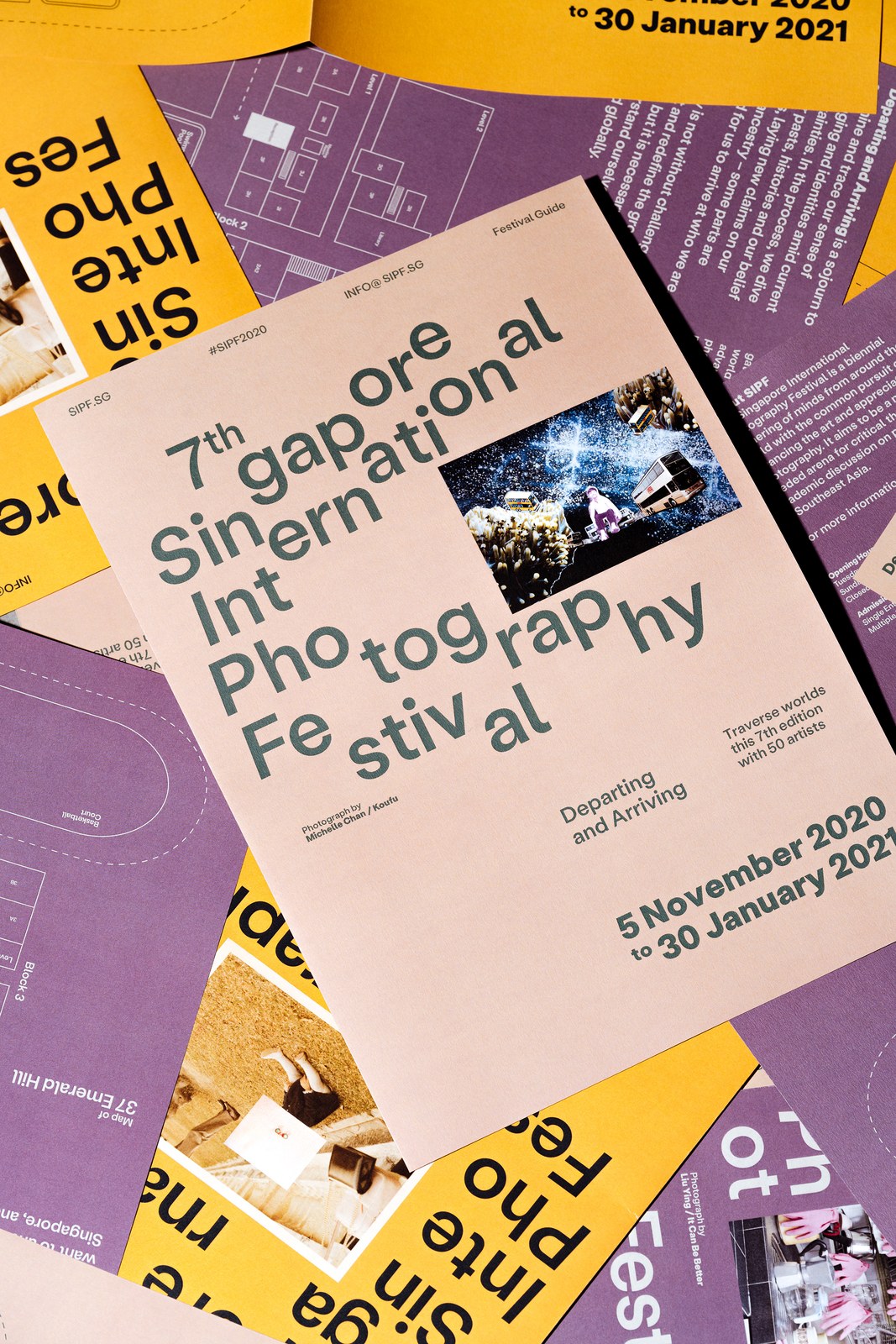 7th Singapore International Photography Festival Guide printed on blush-sand, saffron-yellow, and plum-purple paper