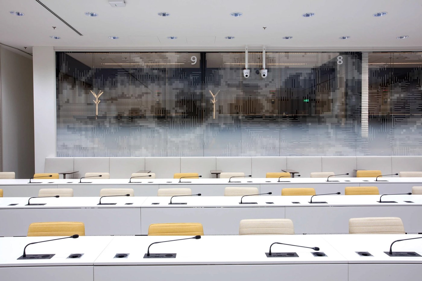 Spatial design glass partition wall patterns in Eurojust hearing room