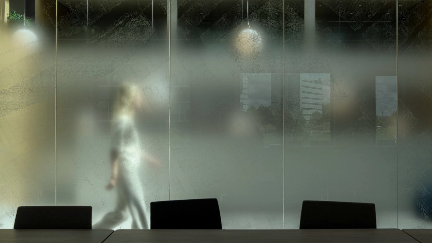 Conference room glass privacy film gradient in modern spatial design