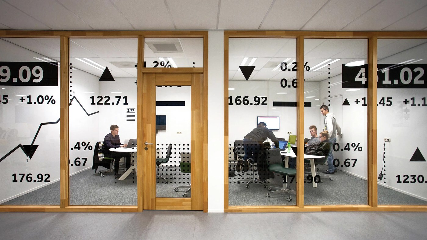 Economic Studies glass meeting room financial data typography — spatial design by Silo