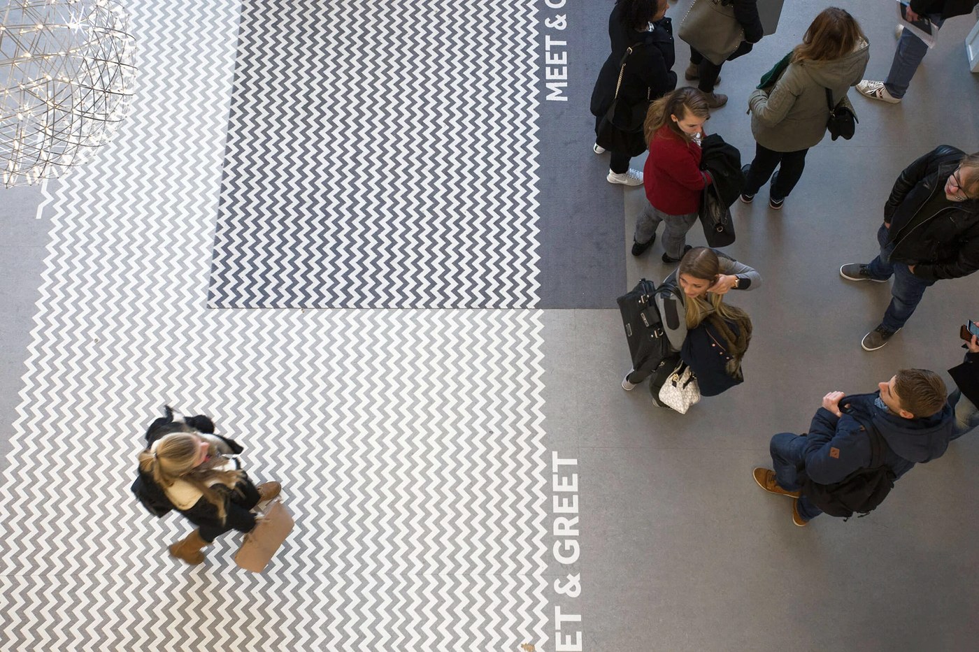 Social carpet chevron floor pattern and meet and greet area — spatial design by Silo