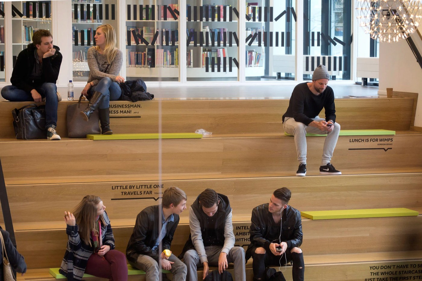 Social staircase amphitheater seating with typographic quotes — spatial design by Silo