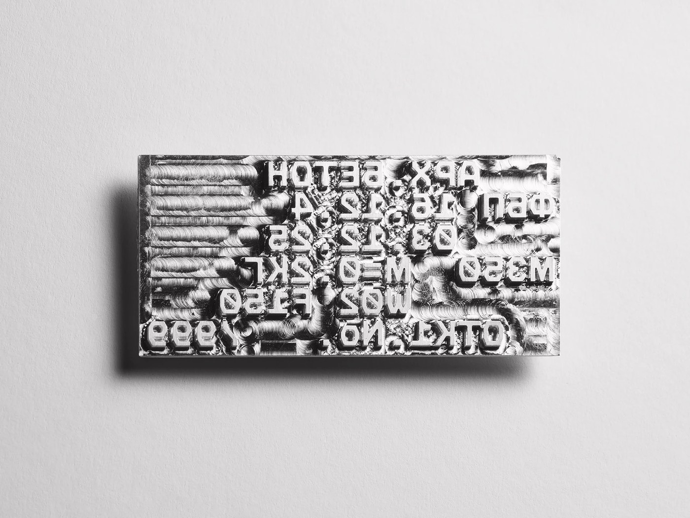 Milled metal stamping die plate for monospaced hot foil stamping in packaging design