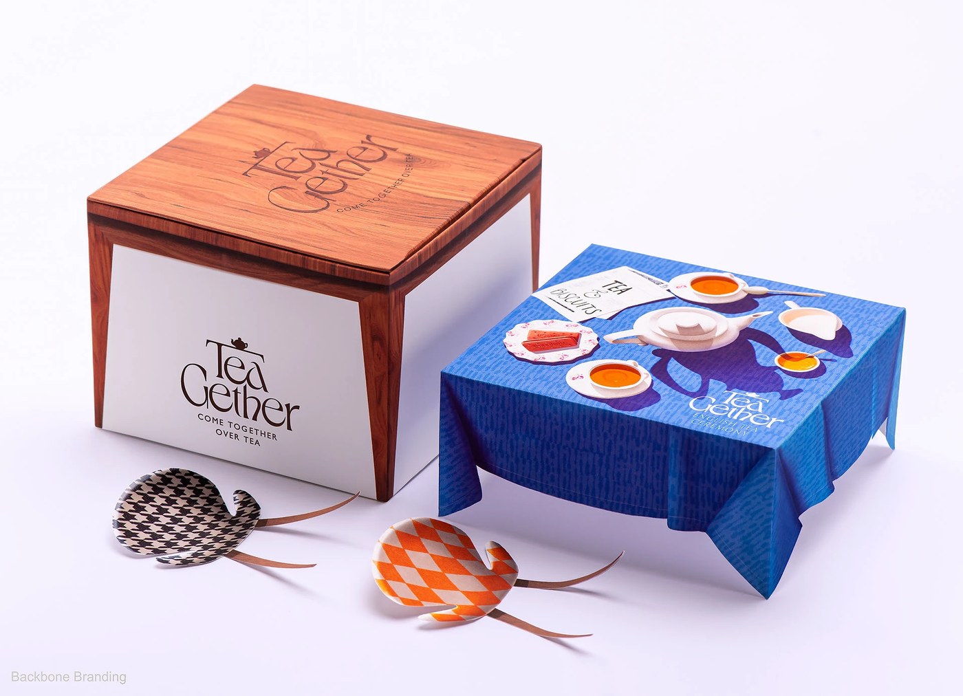 Structural confectionery drawer box and wooden table packaging design by Backbone Branding