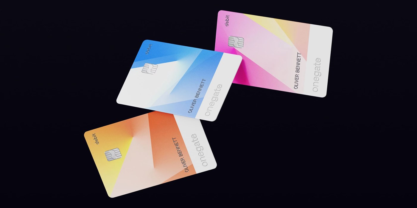 The OneGate debit card suite displaying three vibrant gradient colorways in orange, blue, and magenta