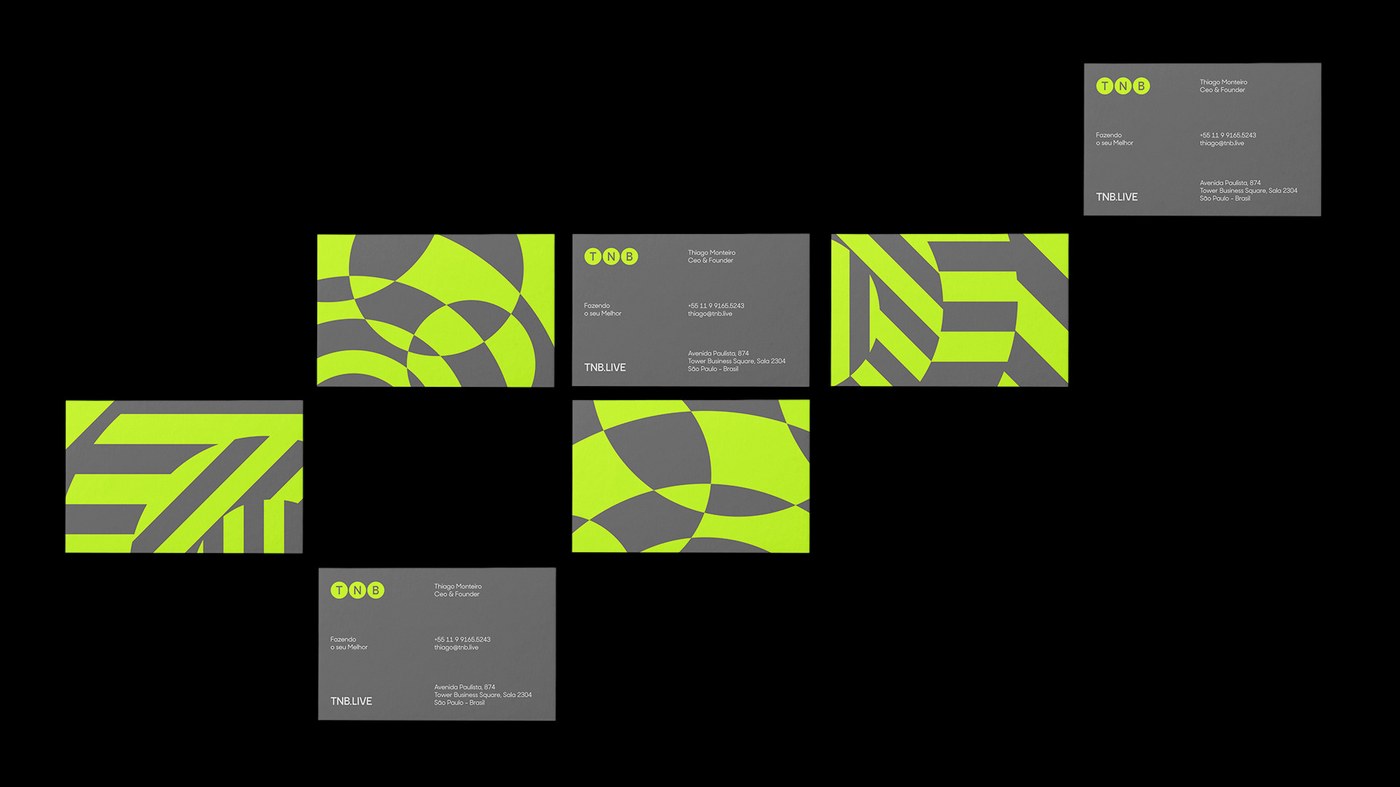 TNB brand identity stationery suite showing interlocking spotlight circles and letterform ribbons