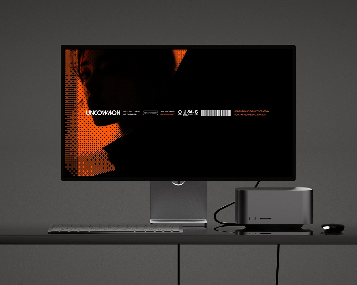 Uncommon brand identity Apple Studio Display workstation with dithered halftone portrait wallpaper