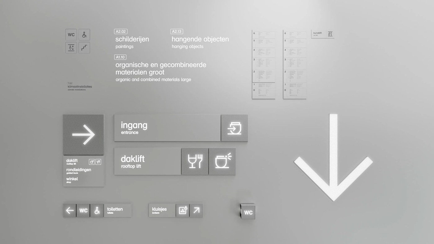 Modular directional signage and illuminated glyphs in spatial design by Silo