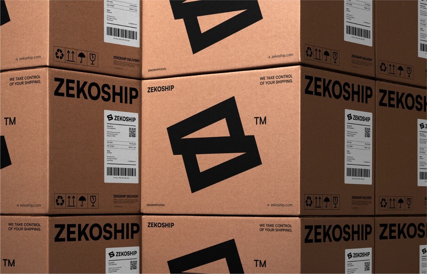 Stacked corrugated shipping cartons printed with bold ZEKOSHIP logotype and barcode shipping telemetry labels