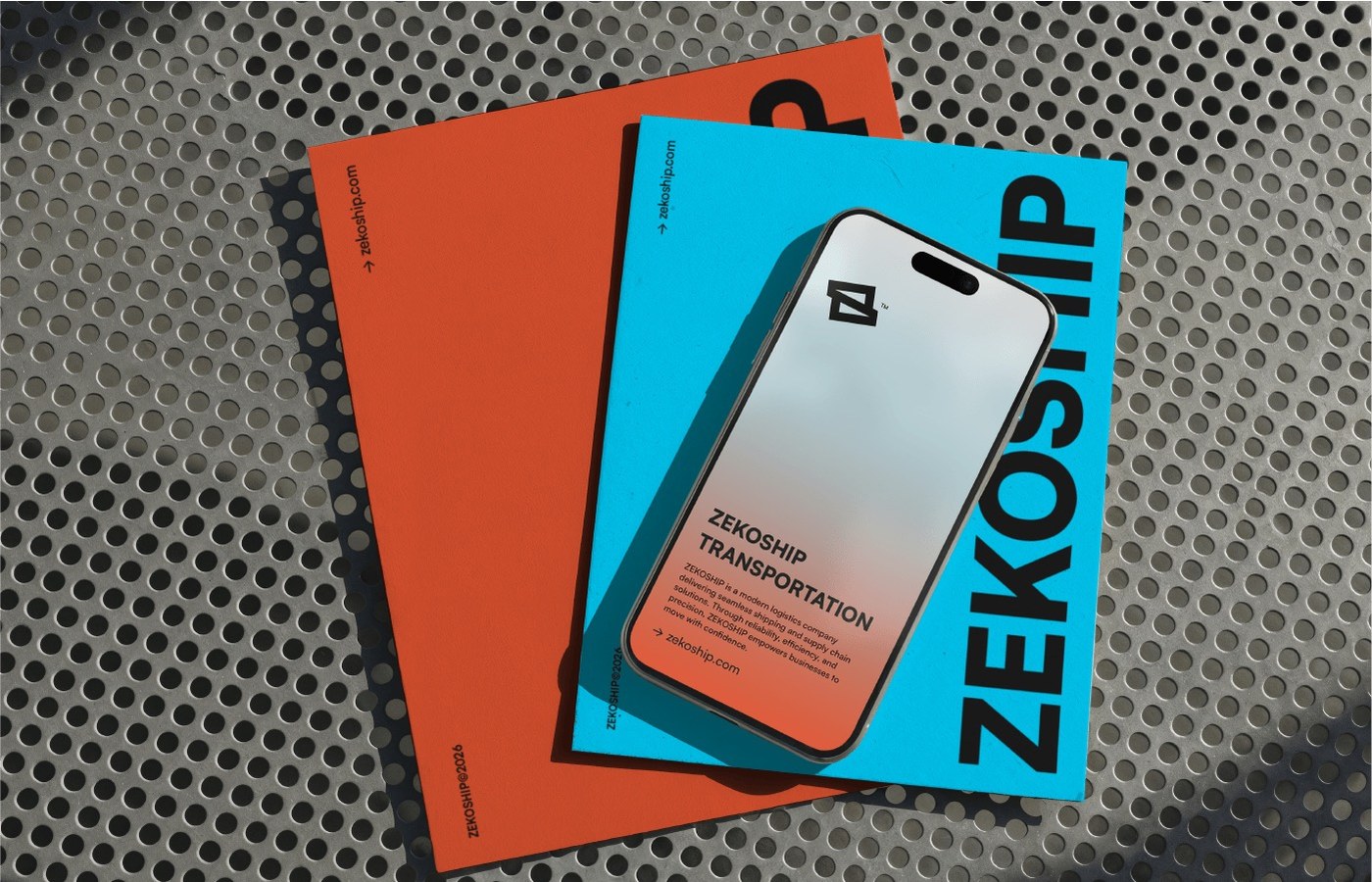 Smartphone and printed brand identity manuals resting on industrial perforated steel mesh bench