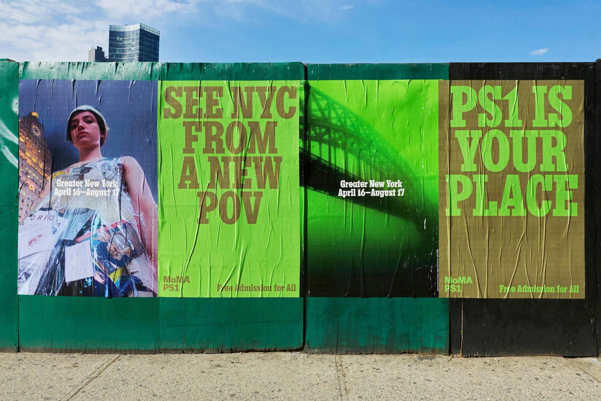 Wild postings on a green construction hoarding: SEE NYC FROM A NEW POV in olive on acid lime beside a duotone bridge photograph and PS1 IS YOUR PLACE panels