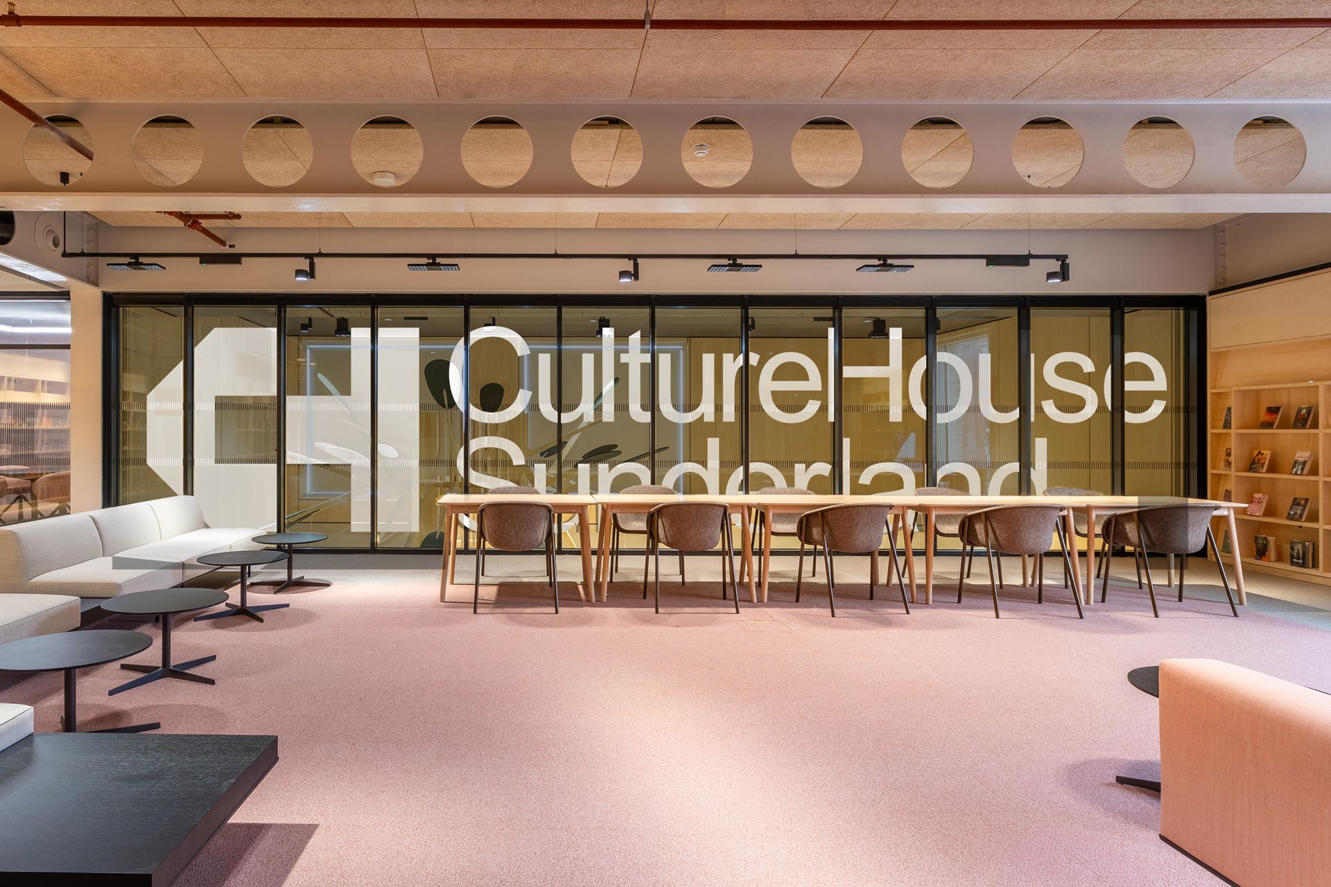 CultureHouse Sunderland wordmark applied across glass walls in the building interior