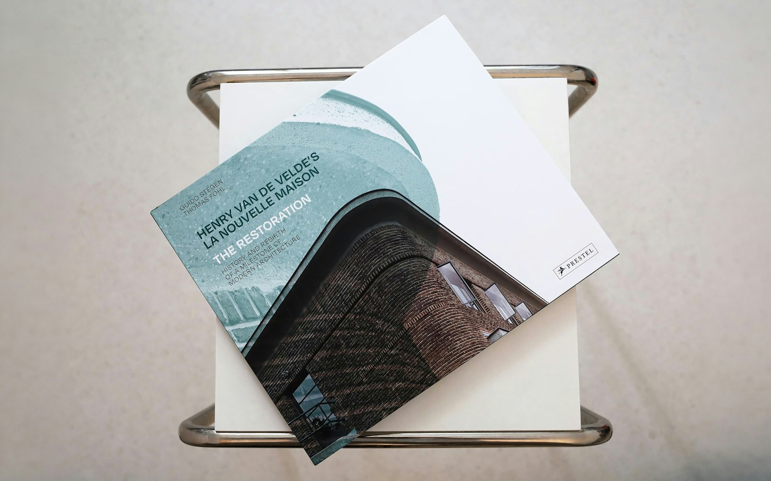 La Nouvelle Maison book resting on a chair