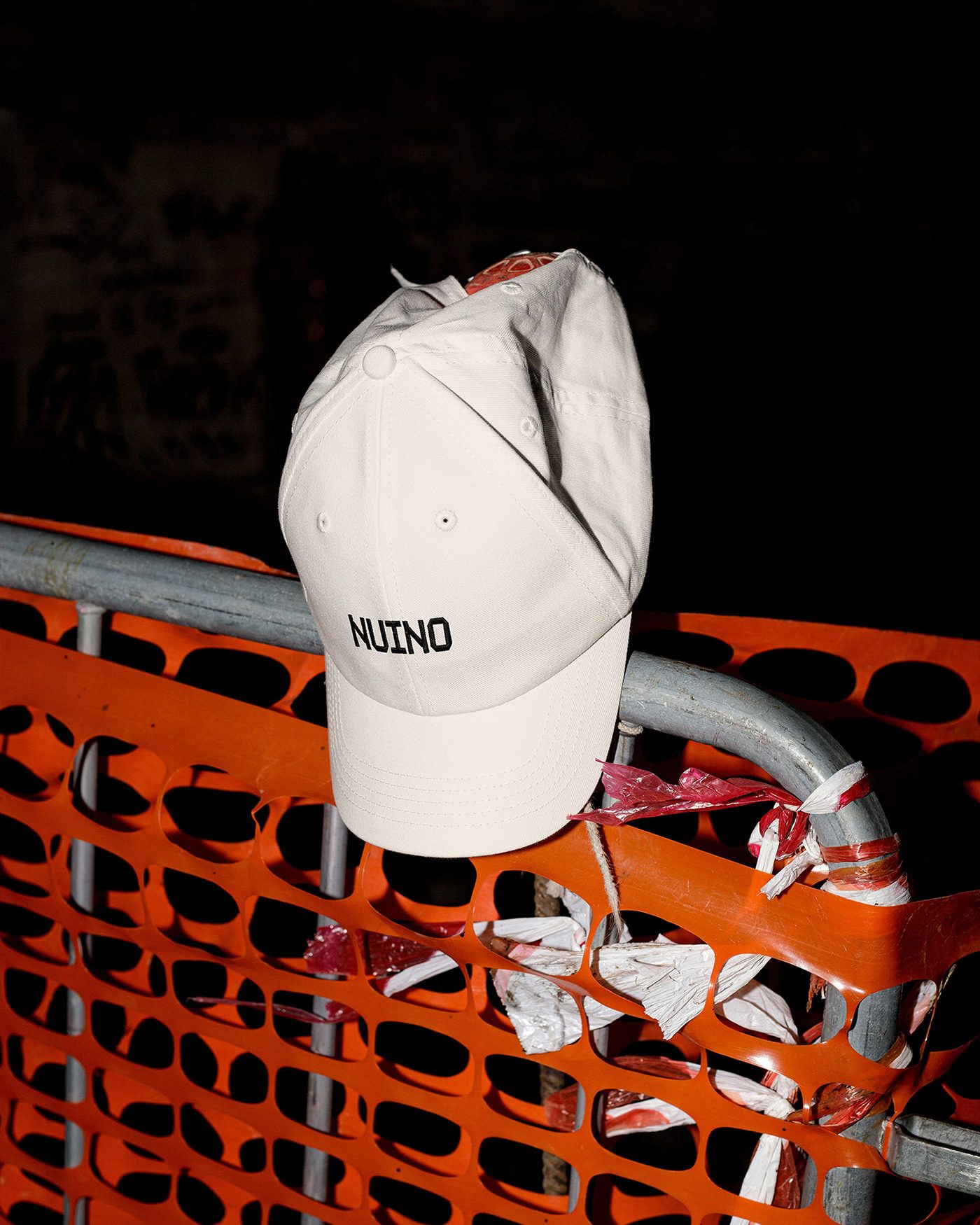 NUINO footwear repair branding embroidered white cotton cap with octagonal wordmark