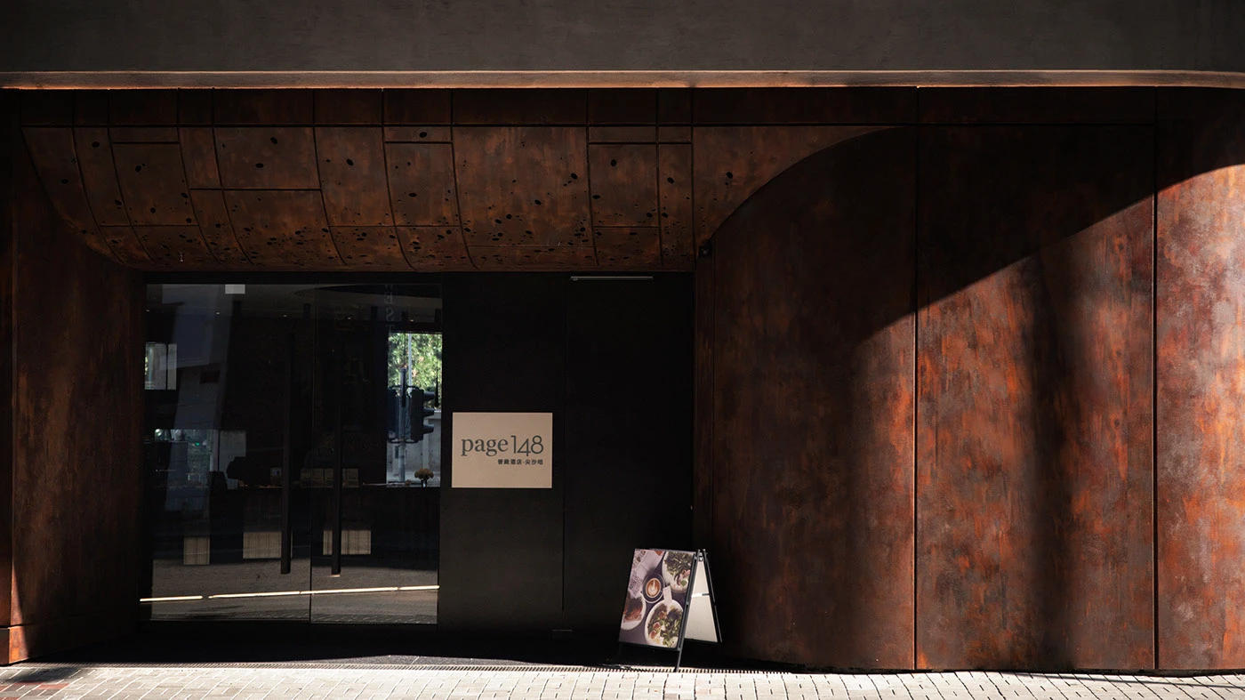 Page Common branding weathered Corten steel exterior cafe facade