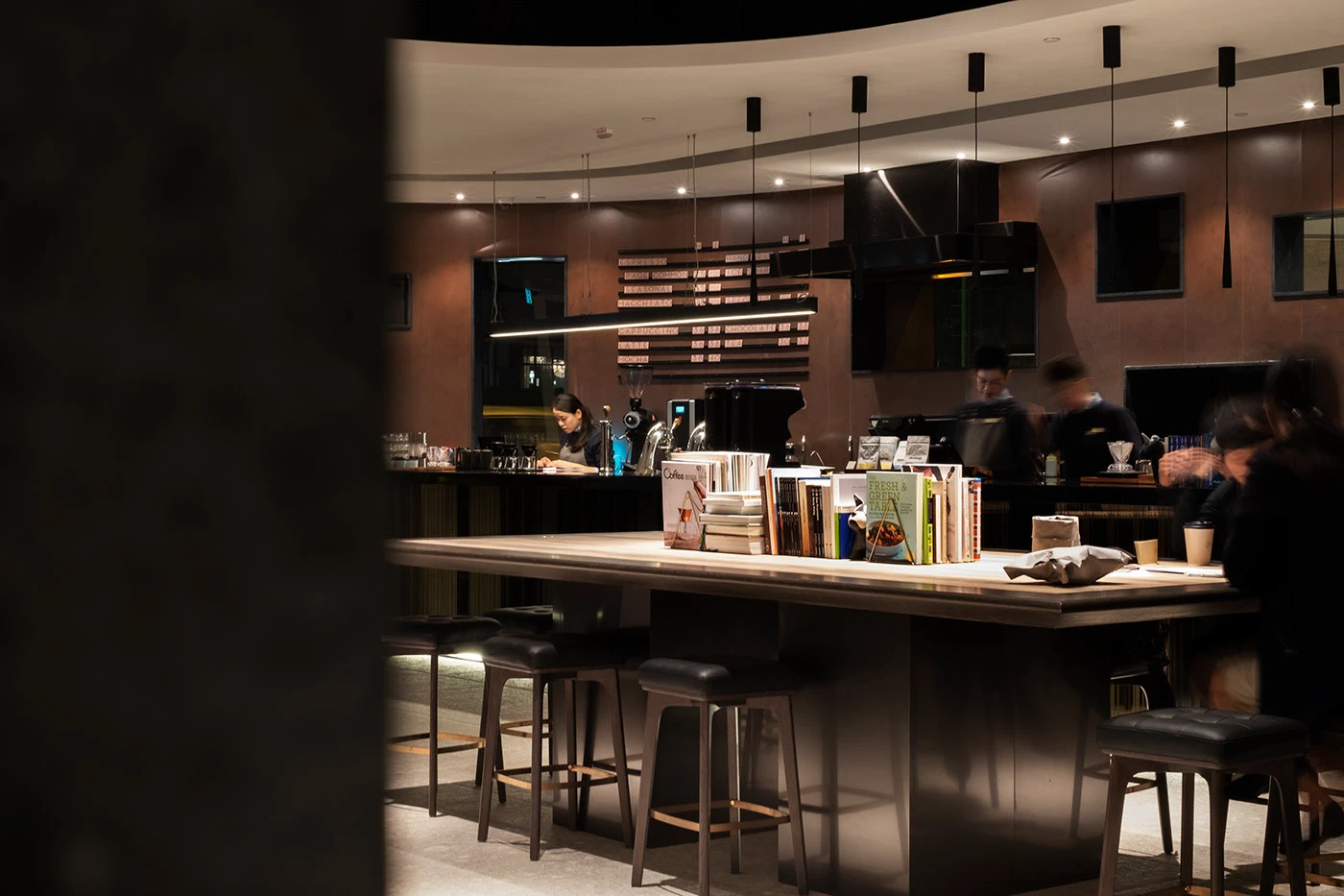Page Common branding coffee bar interior and curated book display