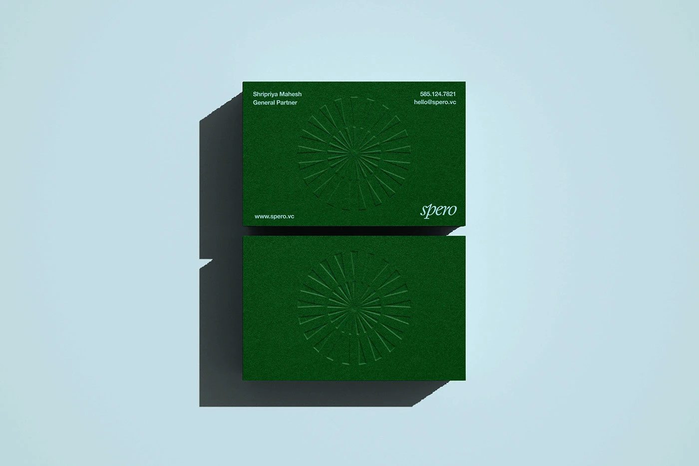 Spero Ventures branding stacked business cards with debossed starburst logo