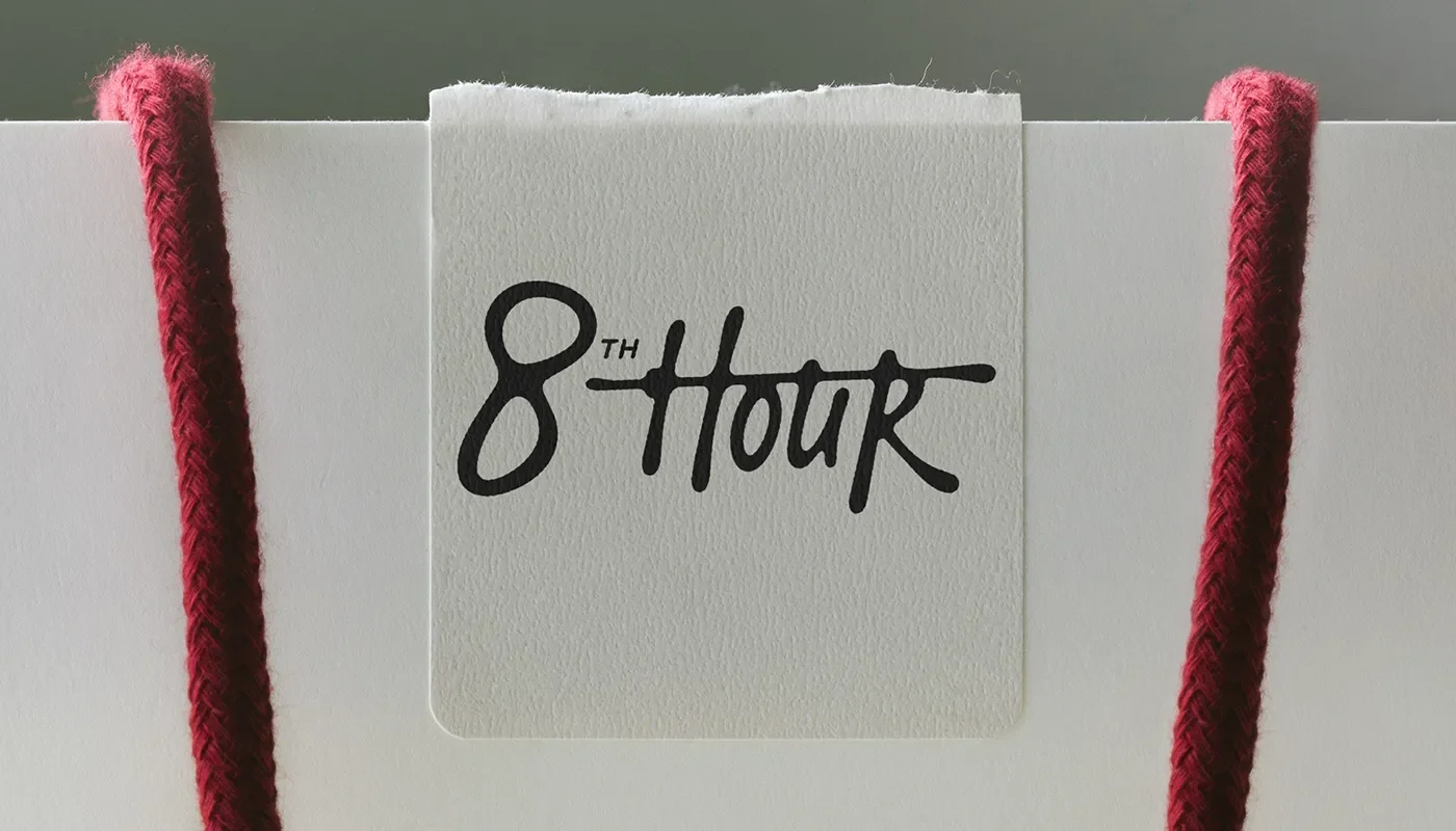 8th Hour branding shopping bag and wordmark label detail