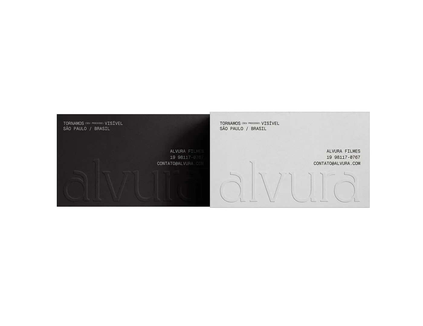 Alvura Filmes branding black and light grey business cards flat-lay by Gabriel Pio Couto and Edson Naves