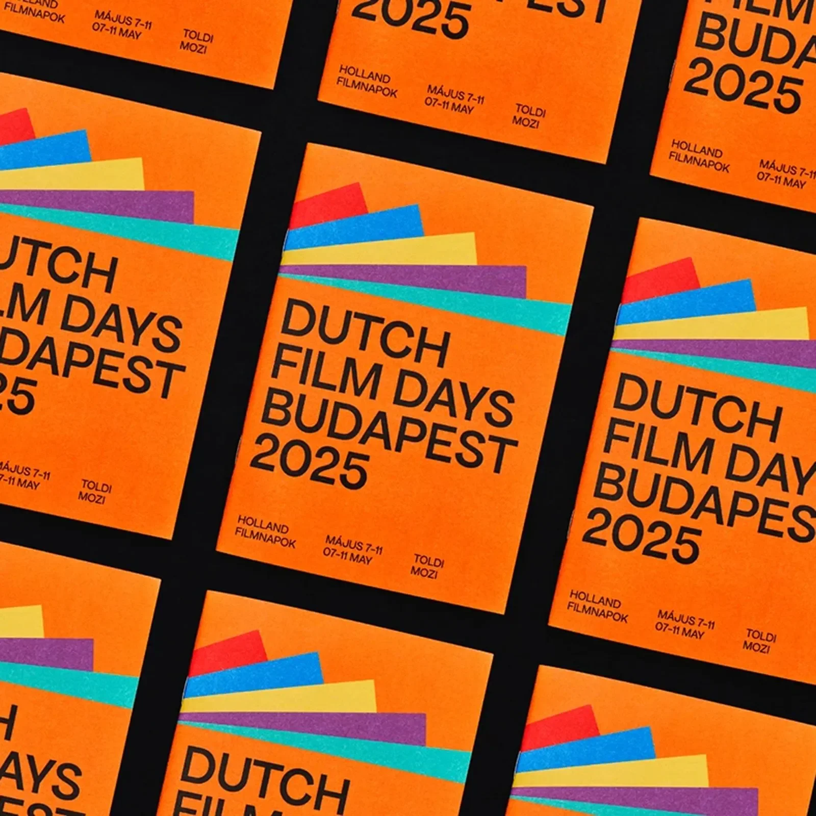 Dutch Film Days poster with bold Dutch orange and clean sans-serif type on a dark field — Dutch Film Days festival branding