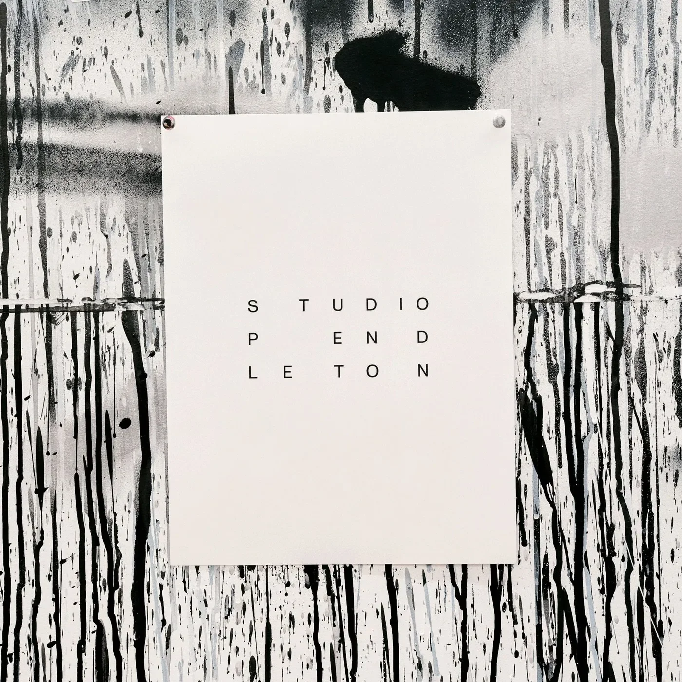 Black Studio Pendleton manifesto poster with typographic principles pinned beside spray-painted artwork by SAVVY STUDIO