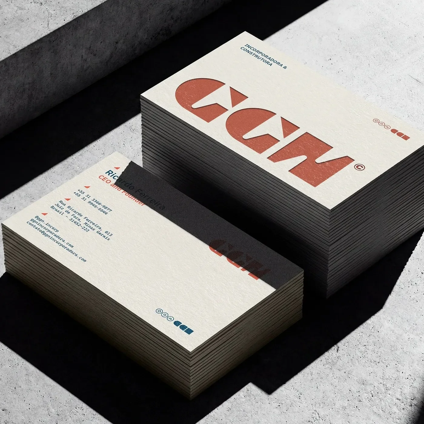 GGN brand identity overview board with stationery, mobile screens, and hard hats