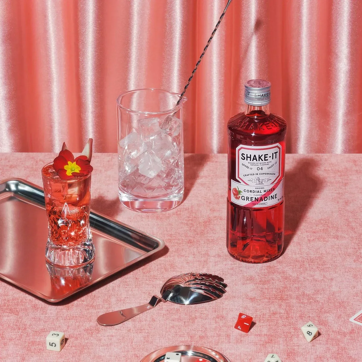 Shake-it Grenadine bottle and cocktail setting in packaging design by OlssønBarbieri