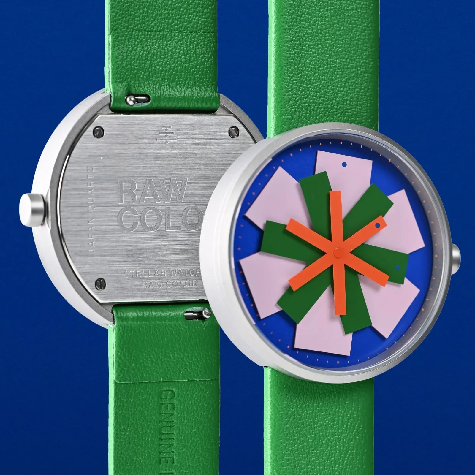 Minimalist stellar watch design showing layered colored hands forming a star pattern