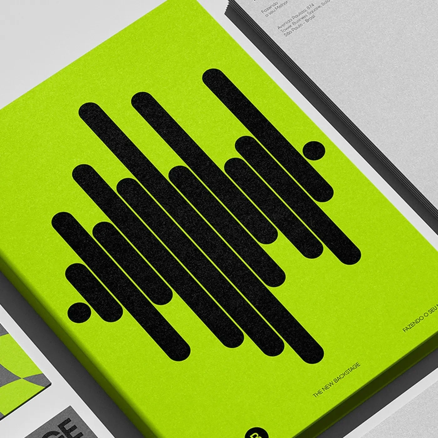 TNB brand identity tactile neon lime brand manual and illuminated outdoor transit poster