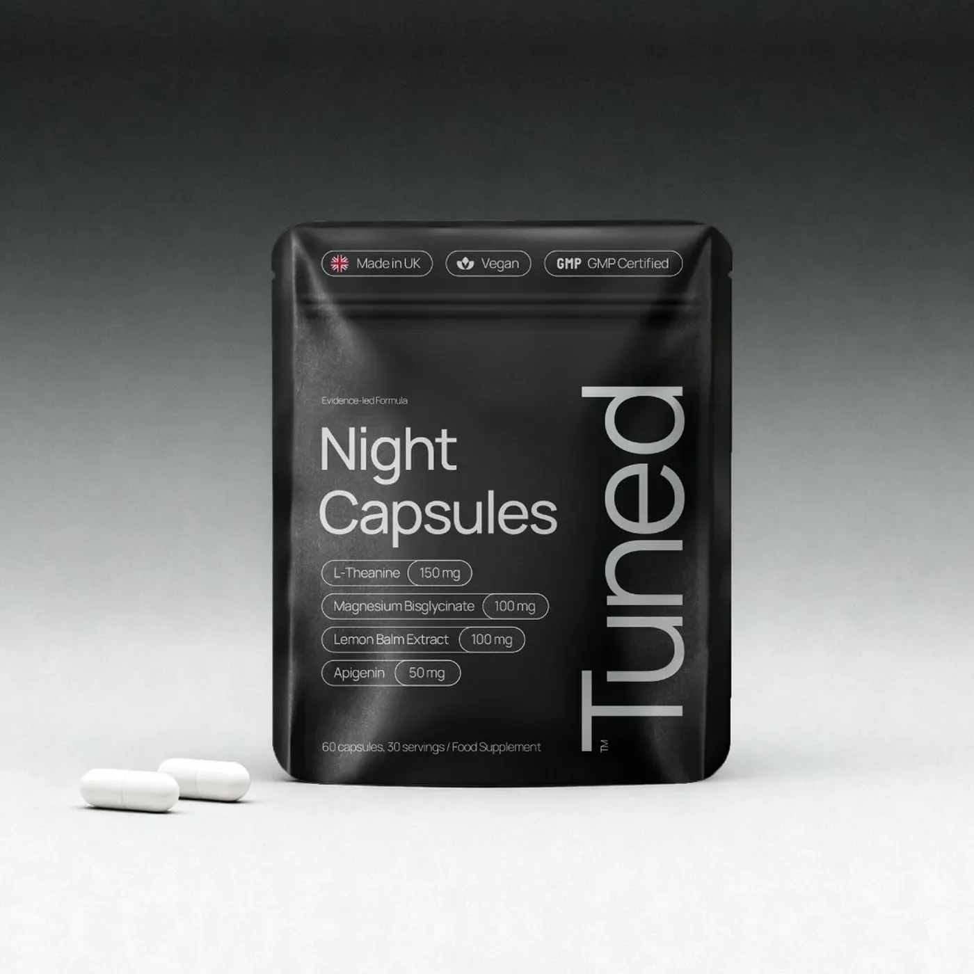 Tuned sleep supplement packaging design and brand identity system overview featuring night capsules pouch with vertical wordmark and dosage telemetry