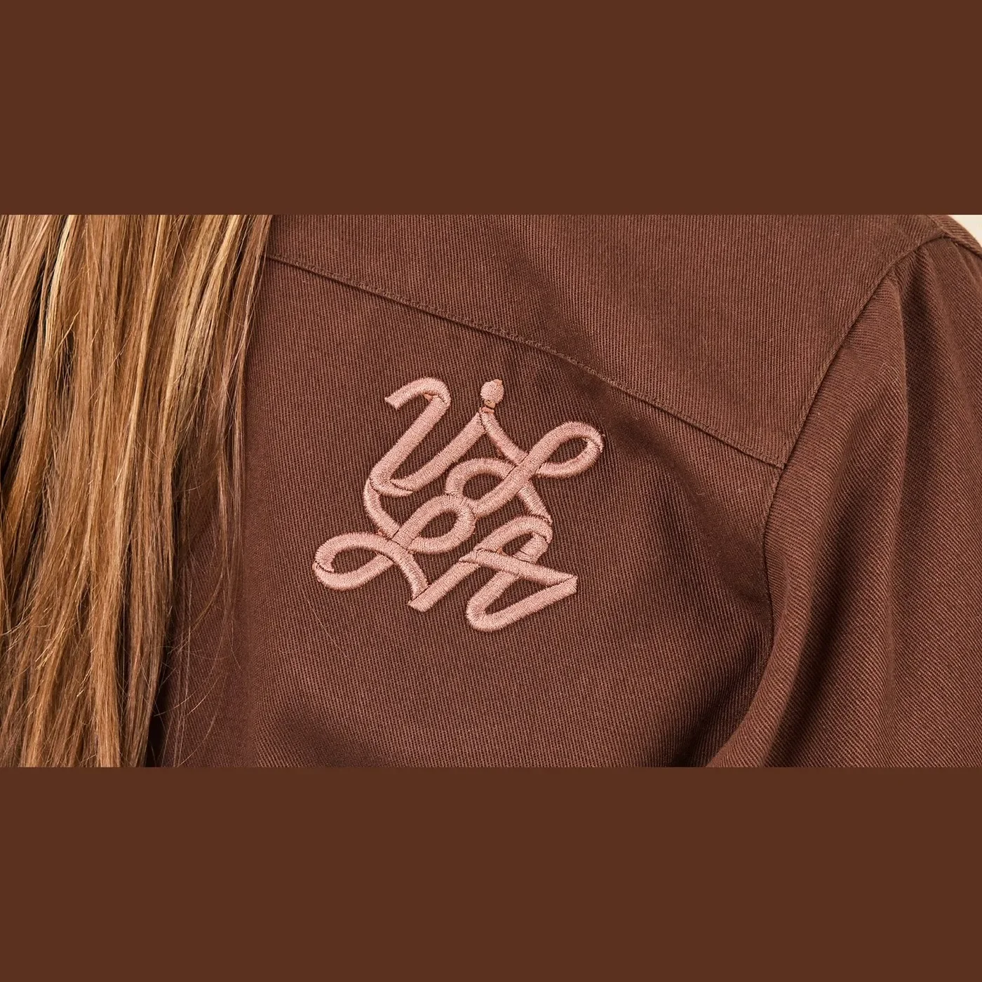 W.T.VILLA branding design heavy cotton twill jacket with embroidered copper knot monogram by María Centeno
