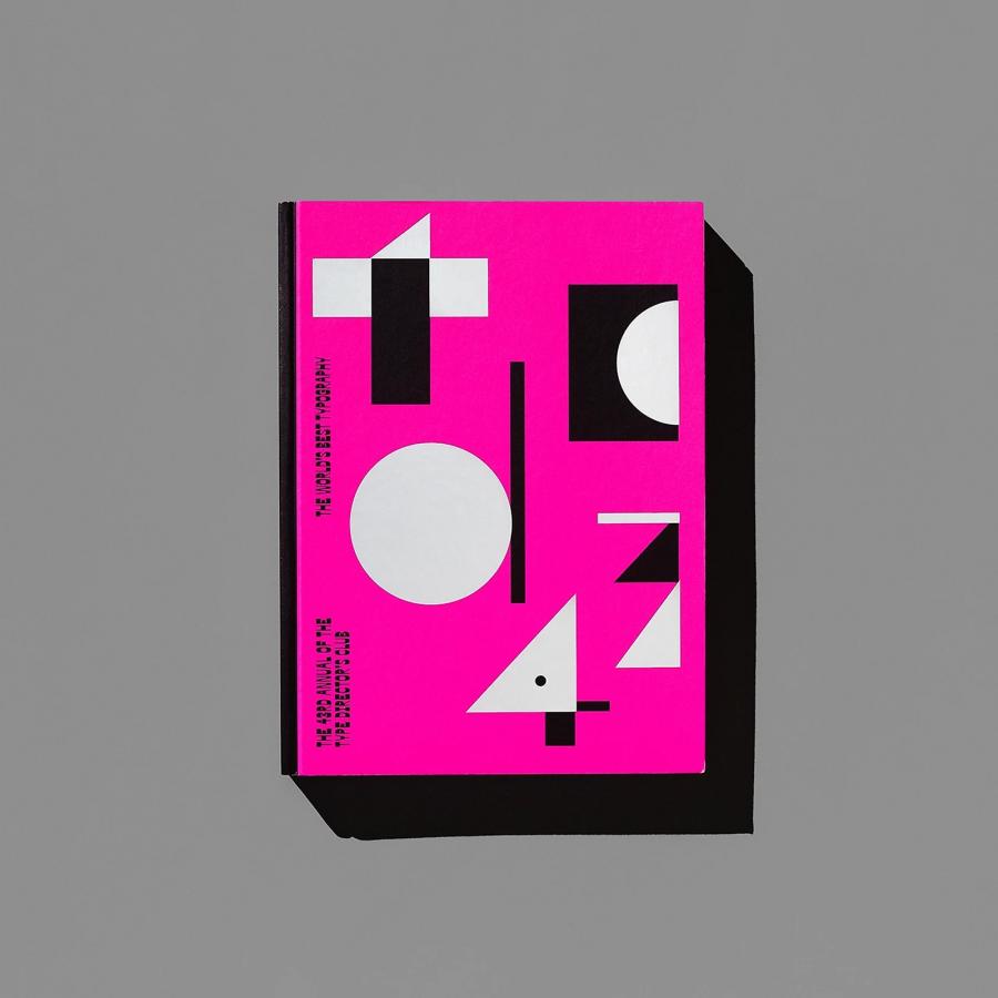 Top-down flat lay of The 43rd Annual of the Type Directors Club hardcover cover featuring expanded counterform typography — editorial design by Tereza Bettinardi