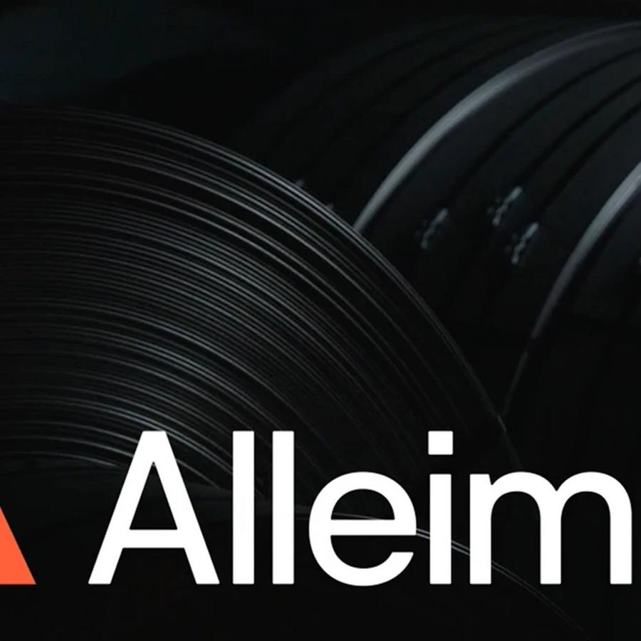 Alleima logotype and Molten Orange A-monogram set over dark rolled steel coils by Kurppa Hosk