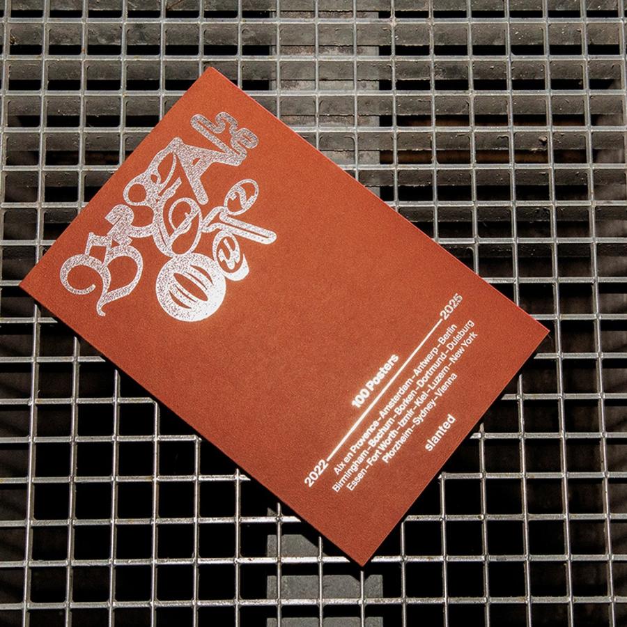 poster book design Breakout #2 cover with terracotta field and hot-foil embossed blackletter by Cihan Tamti