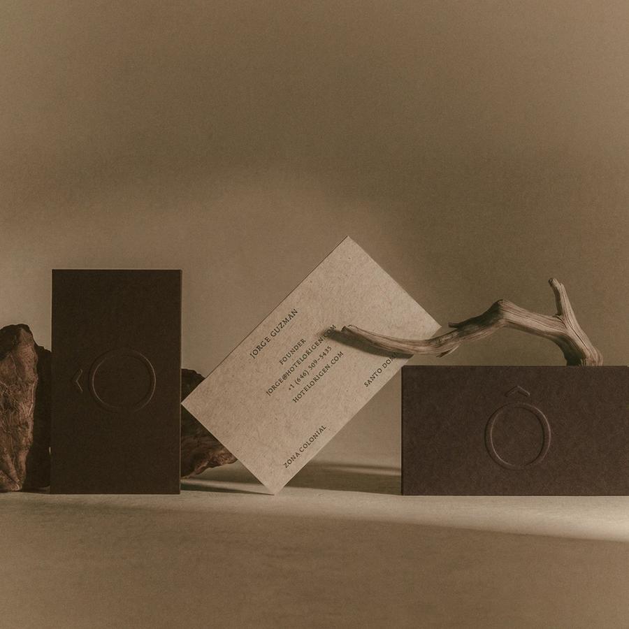hotel rigen fugitiva .co branding business cards on a textured beige surface