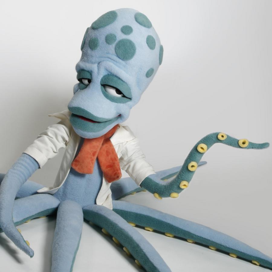custom puppet design — smooth rubber octopus with articulated mechanical eyes by Furry Puppet Studio