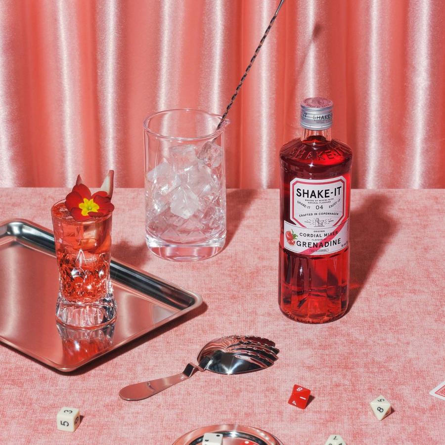 Shake-it Grenadine bottle and cocktail setting in packaging design by OlssønBarbieri