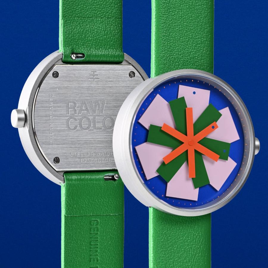 Minimalist stellar watch design showing layered colored hands forming a star pattern