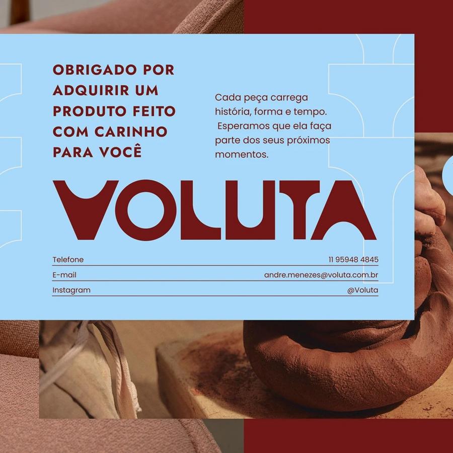 Voluta brand identity master system stationery card with red logotype, cobogó pattern, restored armchair, and handmade ceramics
