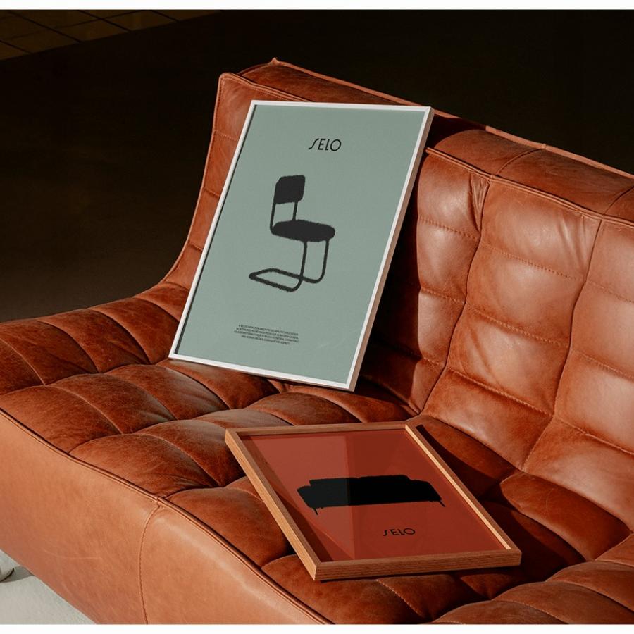 SELO furniture brand identity framed prints on cognac leather sofa