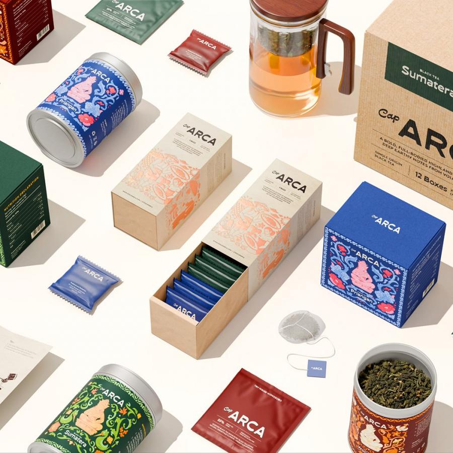 Teh Cap Arca tea branding identity packaging boxes and tin containers flat lay